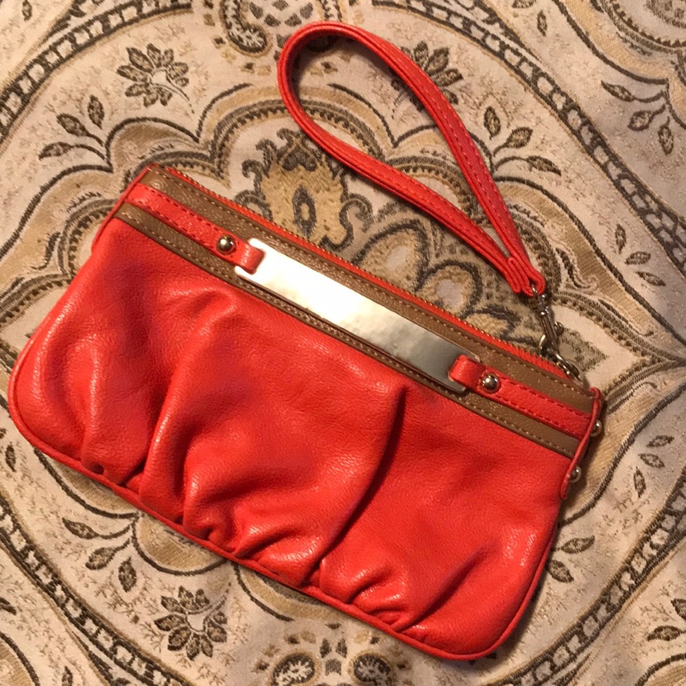 Express orange and tan with gold buckle wristlet